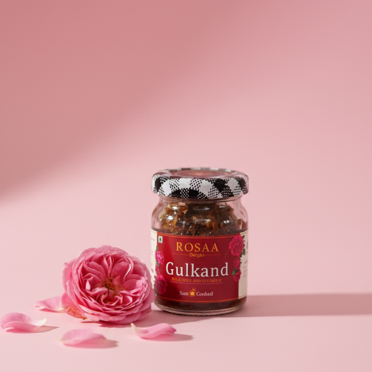 Jar of ROSAA Gulkand with a pink rose on a pink background